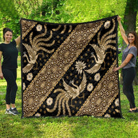 Gold and beige batik-style pattern quilt with ornate animal and floral motifs on dark fabric