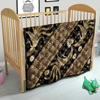 Batik-style quilt with ornate gold and beige figures and diamond accents on dark fabric