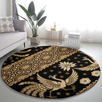 Round batik pattern carpet in dark and gold, featuring bird and floral motifs