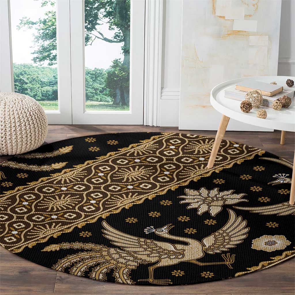 Round batik pattern carpet, dark with gold bird, lattice circles and floral accents