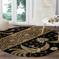 Round batik pattern carpet, dark with gold bird, lattice circles and floral accents