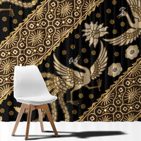 Black fabric with gold batik motifs, featuring birds, flowers, and ornamental lines.