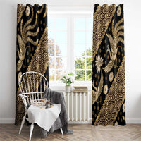 Black and gold batik-pattern window curtains, two hanging panels with ornate motifs.