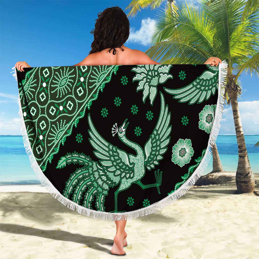Round green batik-pattern beach blanket with white fringe, peacock and flower motifs
