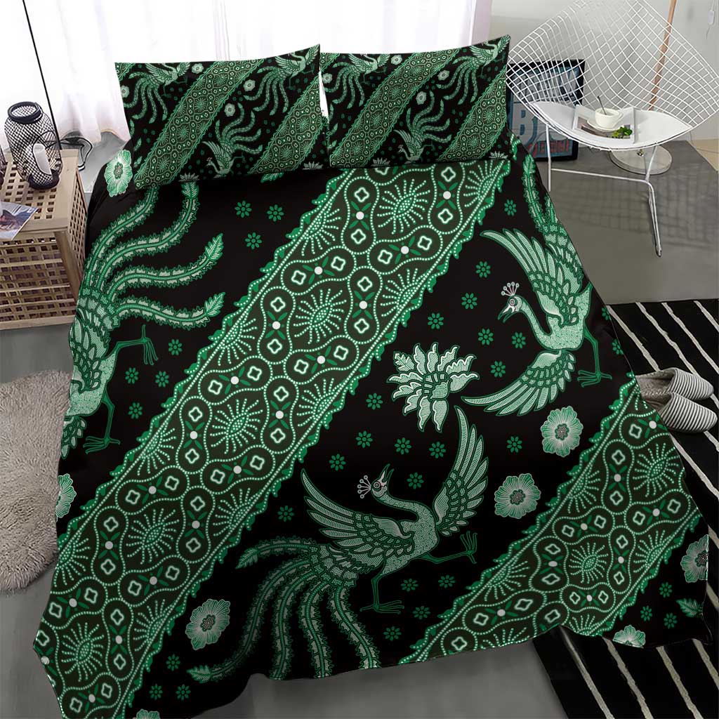 Green batik duvet cover with decorative gecko and floral motifs, plus two pillowcases.
