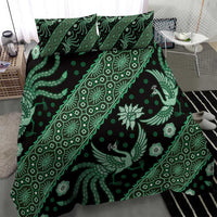 Green batik duvet cover with decorative gecko and floral motifs, plus two pillowcases.