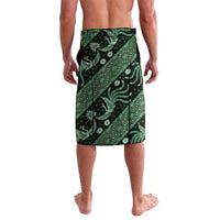 Green batik wrap skirt with central diagonal motifs and floral accents