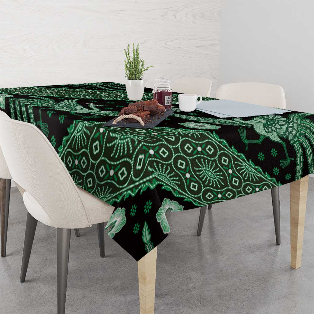 Dark green batik-pattern tablecloth with leafy vines and bird-and-flower motifs