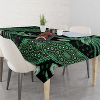 Dark green batik-pattern tablecloth with leafy vines and bird-and-flower motifs
