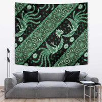 Green batik tapestry with diagonal repeat of stylized birds, flowers, and decorative borders.