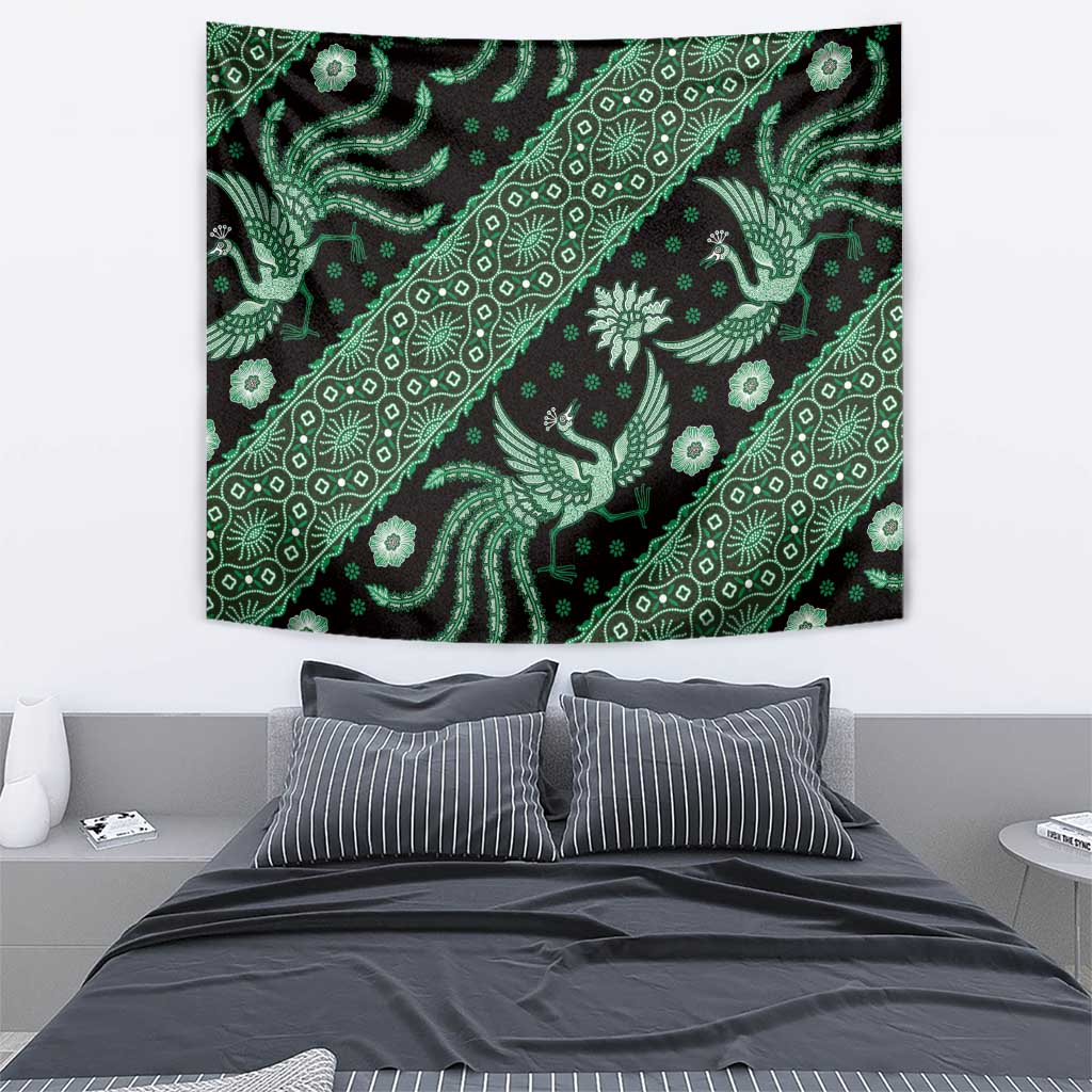 Green and black batik tapestry with diagonal line of bird and flower motifs and ornaments.