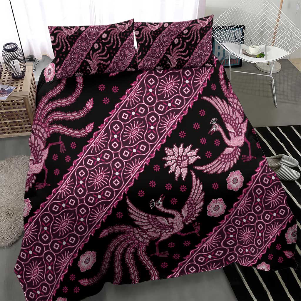 Pink batik pattern bedding set featuring decorative birds and floral accents on duvet