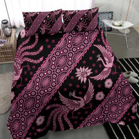 Pink batik pattern bedding set featuring decorative birds and floral accents on duvet