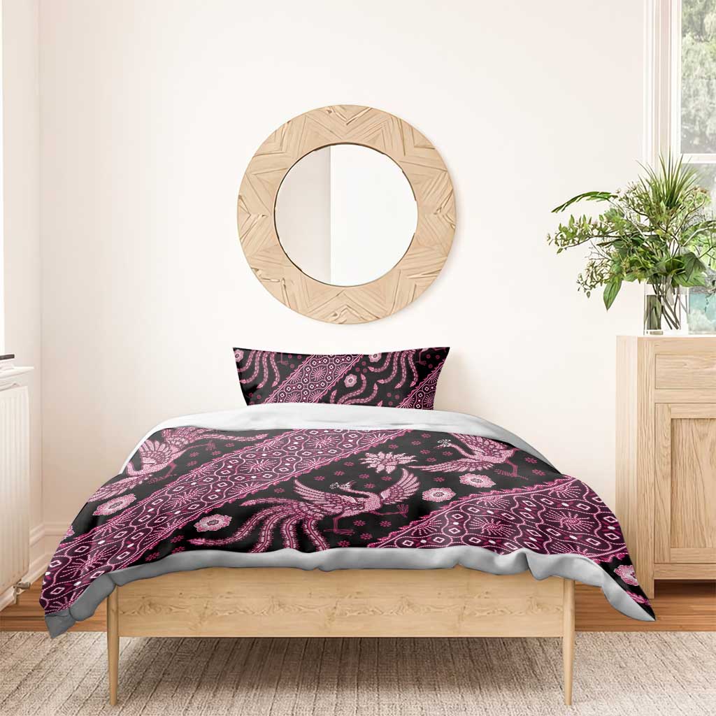 Pink and purple batik bedding set on bed with patterned duvet cover and pillowcase