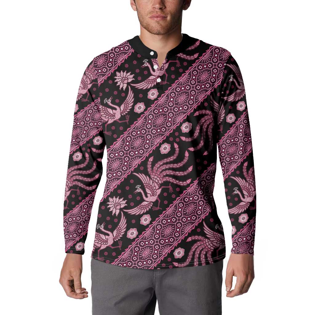 Pink-and-black batik patterned button sweatshirt with black collar and long sleeves