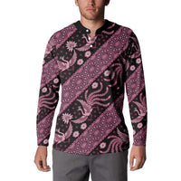 Pink-and-black batik patterned button sweatshirt with black collar and long sleeves