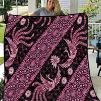 Pink and black batik-pattern quilt close view, intricate peacock and geometric motifs.