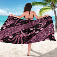 Pink and black batik-pattern sarong wrap, back view with bold paisley and floral print