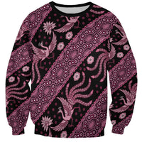 Unisex crewneck sweatshirt, all-over pink batik print on dark base