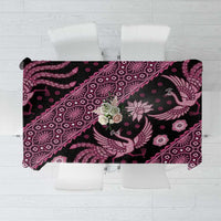 Batik tablecloth with dark base and pink floral and paisley pattern, rectangular hem.