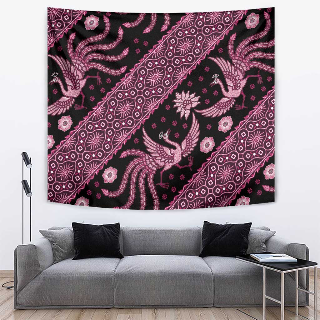 Pink batik pattern tapestry wall hanging with bird and floral motifs over dark background