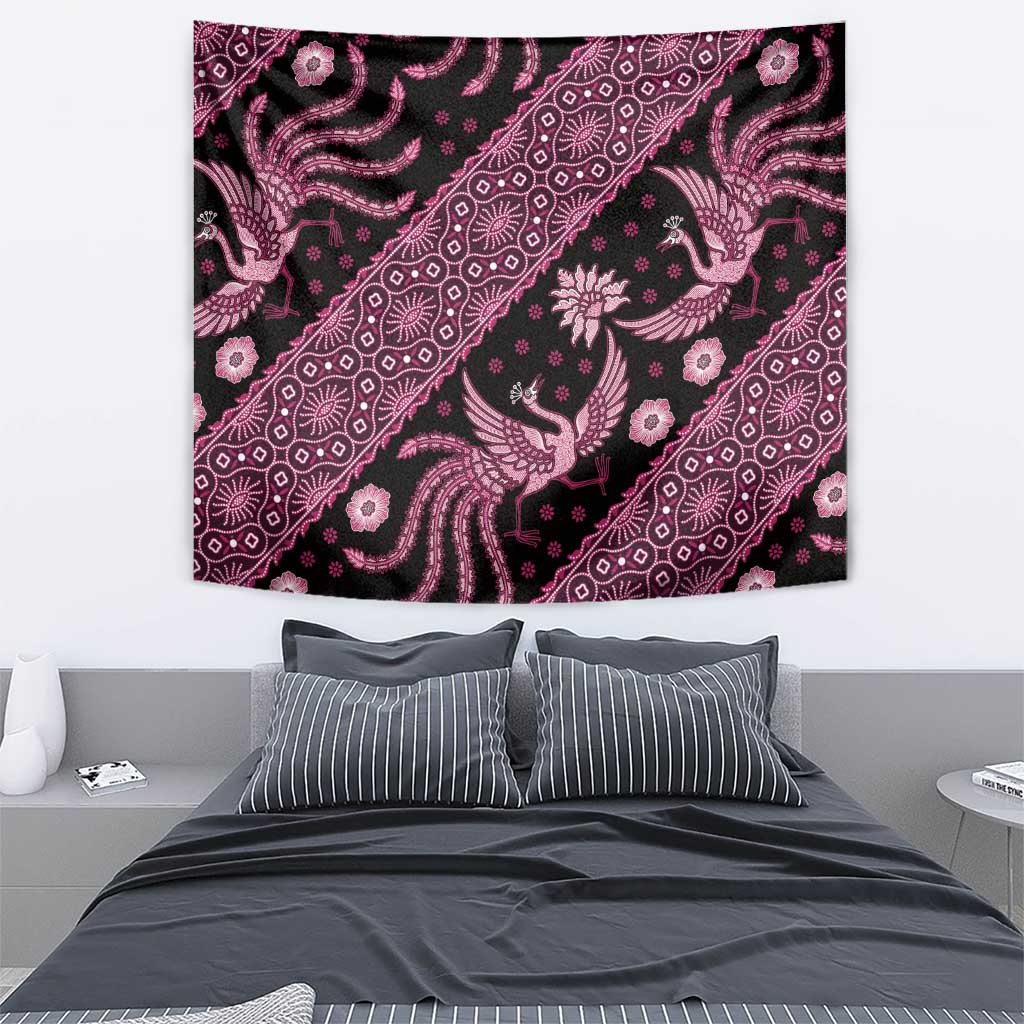 Pink batik pattern tapestry on wall, featuring bird and floral motifs in diagonal bands
