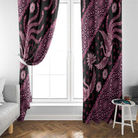 Pink and black batik-pattern window curtains framing a glass window