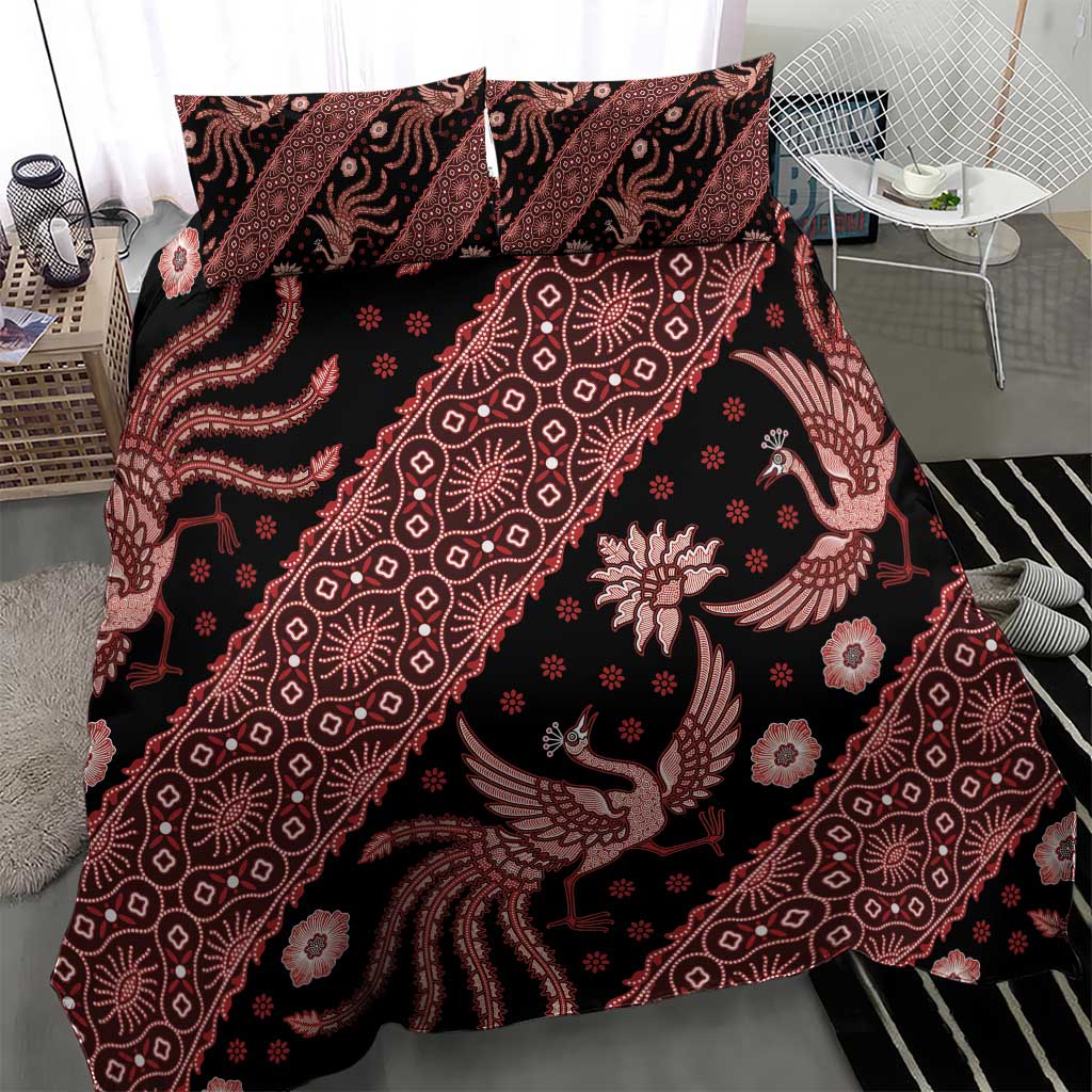 Batik bedding set on bed with red-and-black duvet and two pillowcases, ornamental motifs