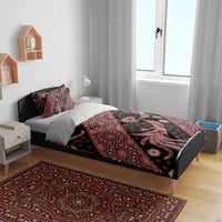 Batik bedding set on bed with red-and-black duvet and two pillowcases, detailed motifs