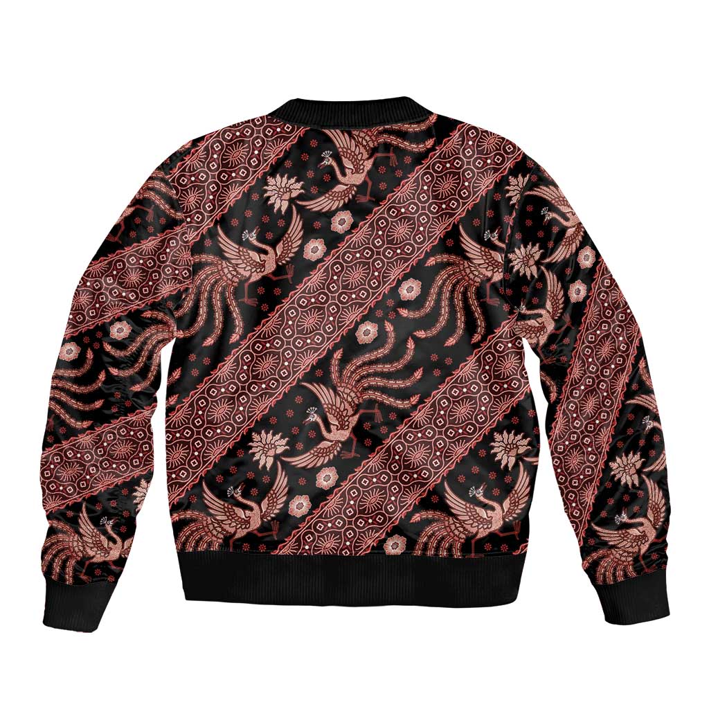 Red batik bomber jacket with black bird and floral print, ribbed collar and hem