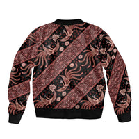 Red batik bomber jacket with black bird and floral print, ribbed collar and hem