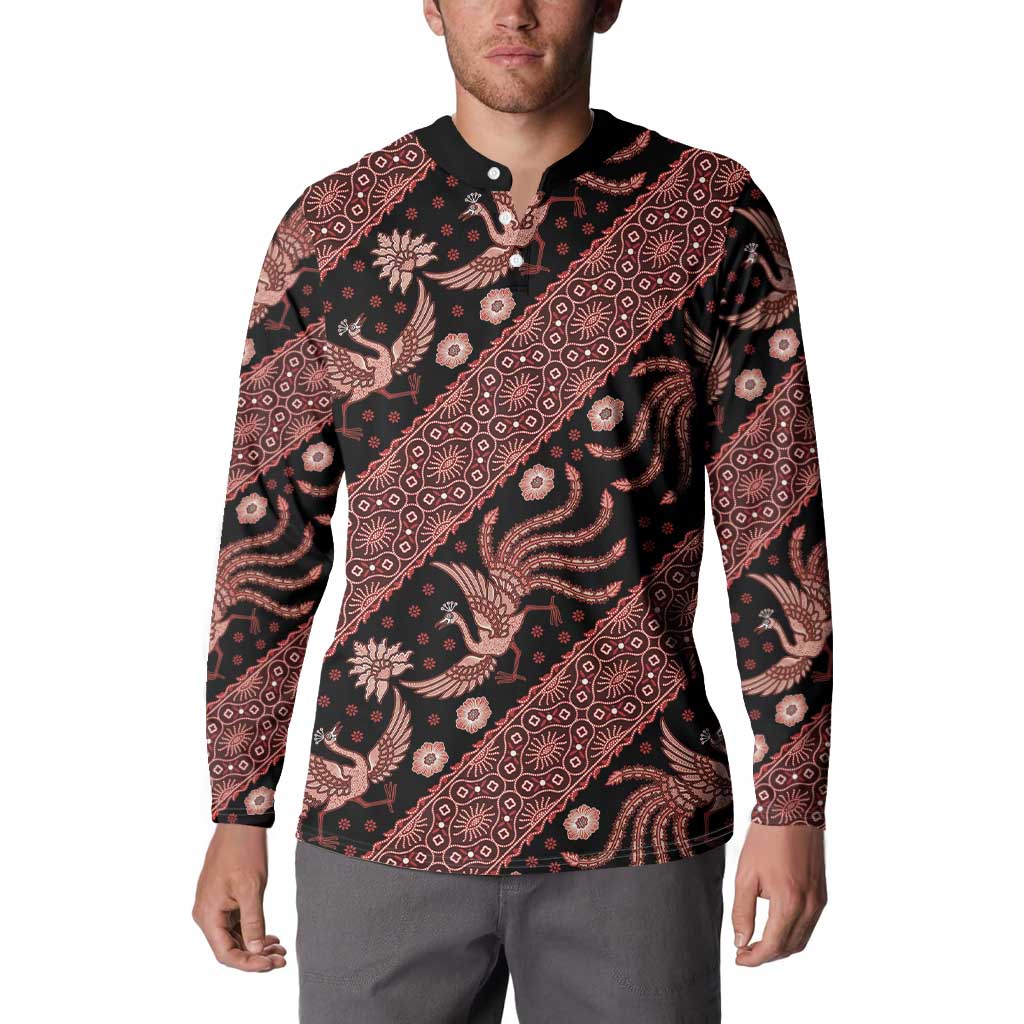 Men’s long-sleeve button-front sweatshirt worn by model, dark with red batik allover print
