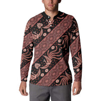 Men’s long-sleeve button-front sweatshirt worn by model, dark with red batik allover print