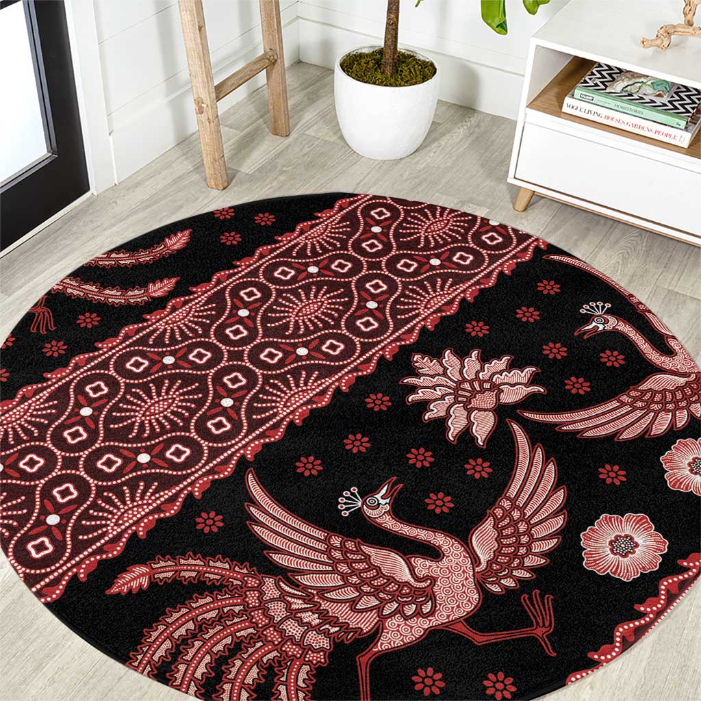 Round batik carpet, black with red bird-and-floral motifs, circular rug