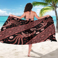 Black batik sarong with red and pink swirling motifs and elephant figures, open wrap