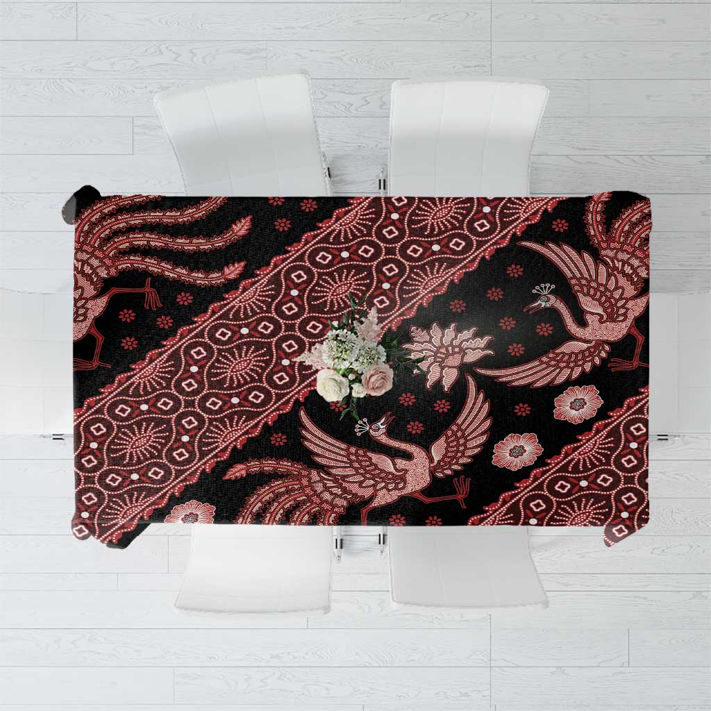 Red batik tablecloth with dark base, intricate bird and floral pattern, rectangular