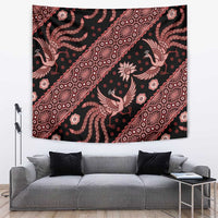 Indonesia batik tapestry hanging above sofa with dark background and red floral bird motif