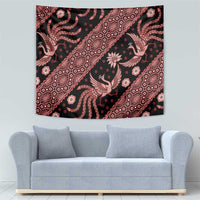 Indonesia batik tapestry with dark background and red floral bird pattern, centered on wall