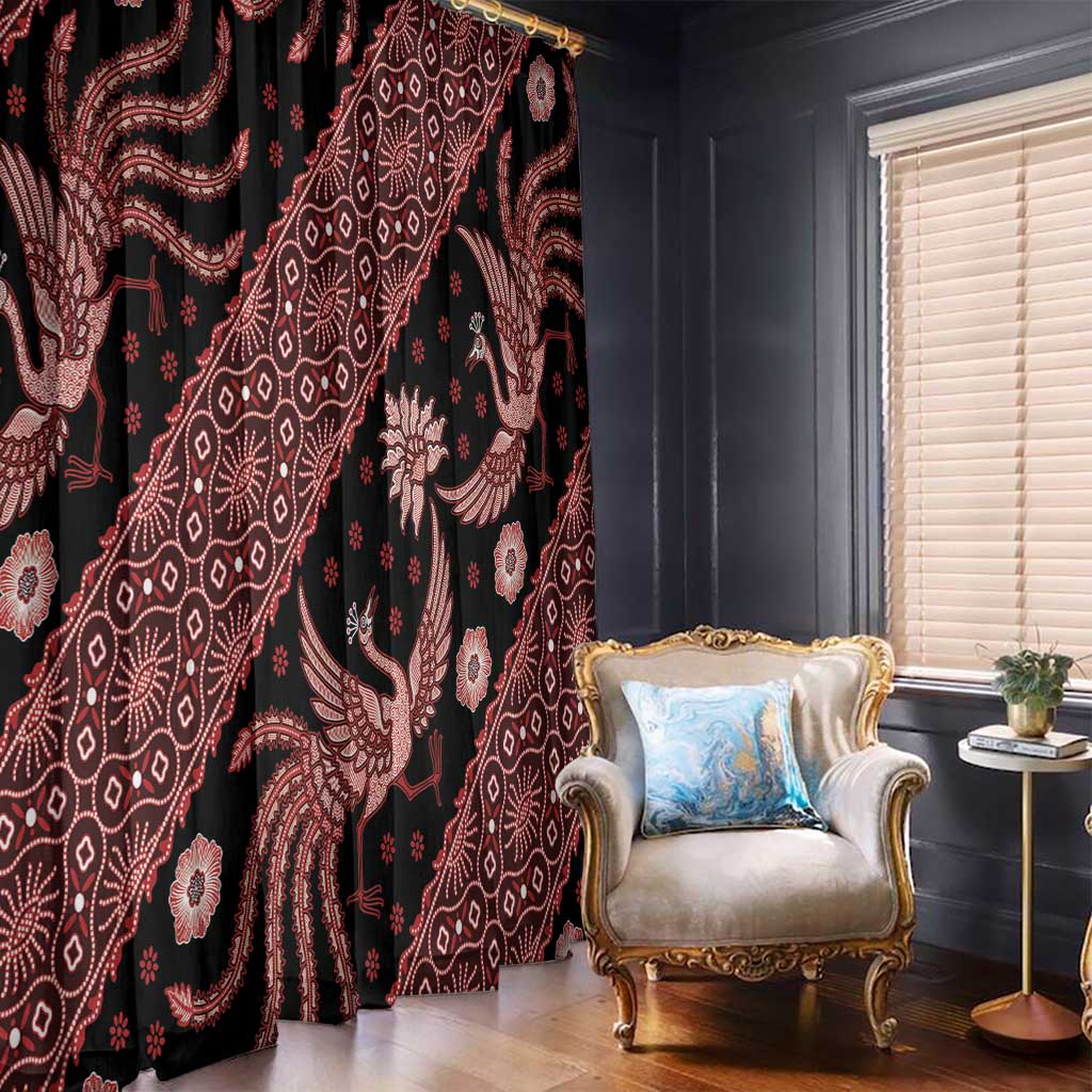 Black window curtains with red batik patterns and large bird motifs