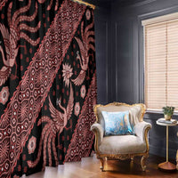 Black window curtains with red batik patterns and large bird motifs