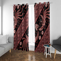 Black window curtains with red batik motifs, hung on a rod