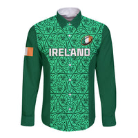 Green long sleeve rugby button shirt with teal ornamental shamrock pattern and ‘Ireland’ text