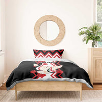 Black bedding set with dove and red-striped chevron motif on duvet and pillow shams