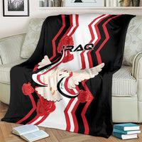 Black blanket with red chevrons and white dove holding flag, IRAQ text across middle.