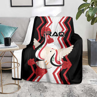 Black blanket with red chevrons and white dove holding a flag, IRAQ logo center.