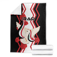 Black throw blanket featuring red zigzag pattern, white dove with flag, IRAQ text.