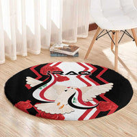 Round black carpet with white dove carrying flag, red chevrons, and red roses