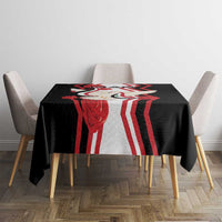 Black tablecloth with dove and flag graphic print, draped over table corners