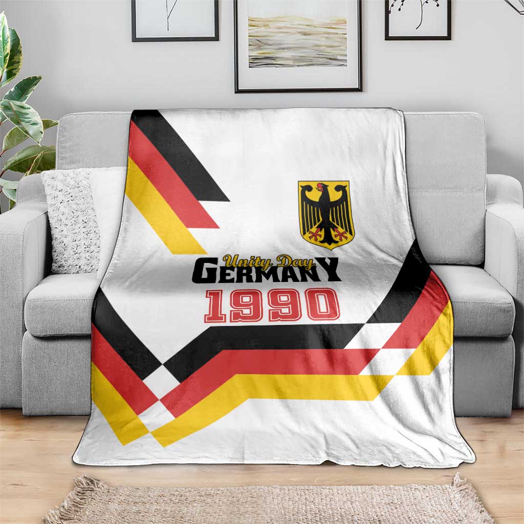 White Germany Unity Day 1990 throw blanket on sofa with crest and graphic chevrons