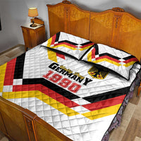 Quilt bed set with two pillows and white quilt showing Germany 1990 Unity Day logo
